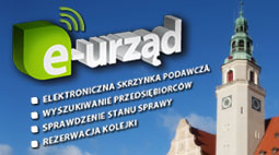 Po prawej stronie grafiki znajduje się zdjęcie Ratusza w Olsztynie, po lewej napis e-urząd oraz elektroniczna skrzynka podawcza, wyszukiwanie przedsiębiorców, sprawdzenie stanu sprawy, rezerwacja kolejki